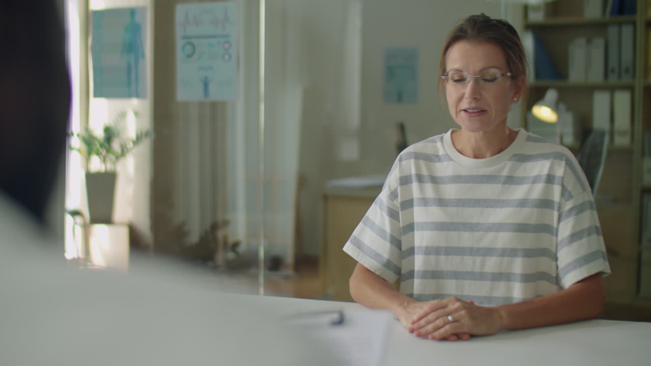 Black Man Complaining about Headache to Doctor