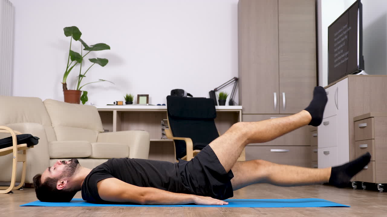 Man doing abdominal exercises at home