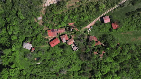 Birds-eye-view-of-Slapnik,-an-abandoned-historic-village-in-Slovenia