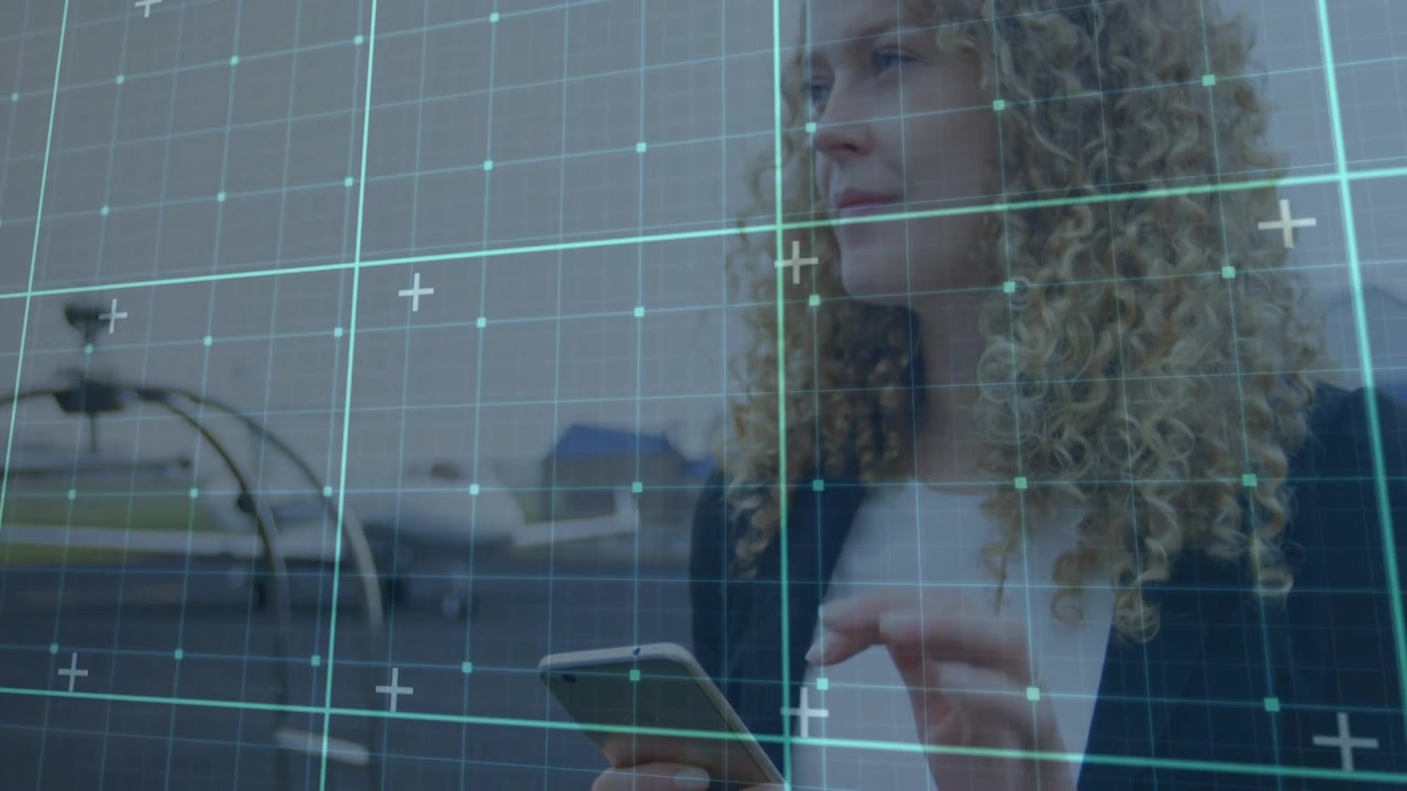Woman tapping phone and scrolling, camera showing face as grid spans hotel desk, checking booking