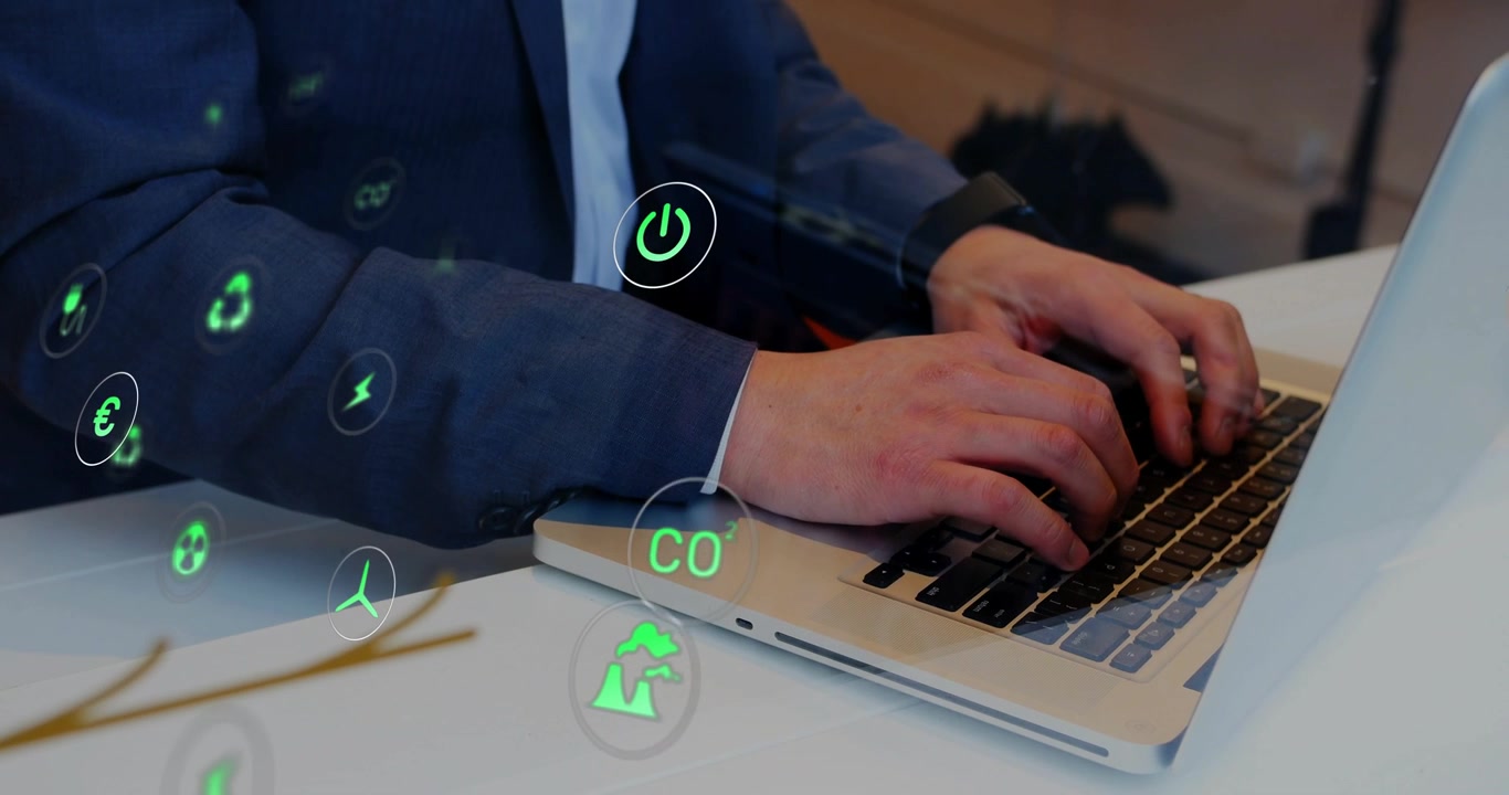 Man placing fingers on keyboard and typing, animating recycle CO2 power icons showing energy impact