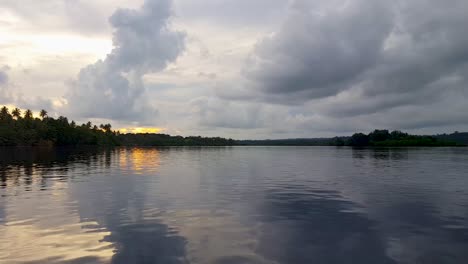exotic, idyllic view of tropical island in the remote shortland islands of western province of the solomon islands with golden sunset sky on a cloudy day