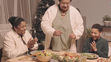 family enjoying christmas dinner together