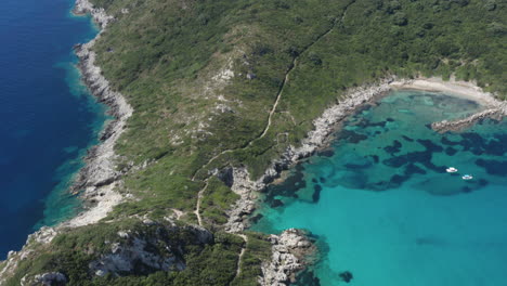 aerial shot flying back to reveal a majestic double beach in the mediterranean