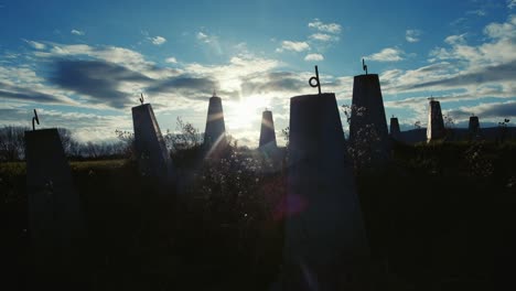 old tank traps near world war two site with sun behind.