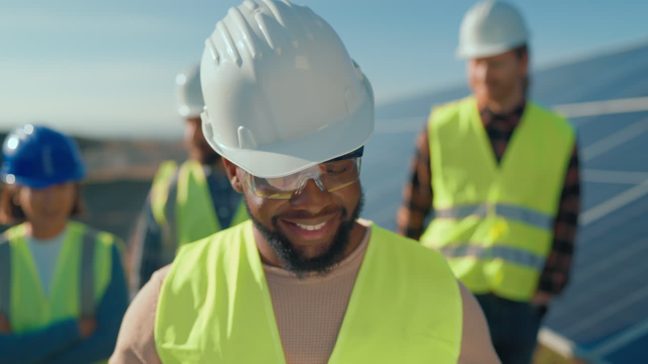 Construction workers installing solar panels