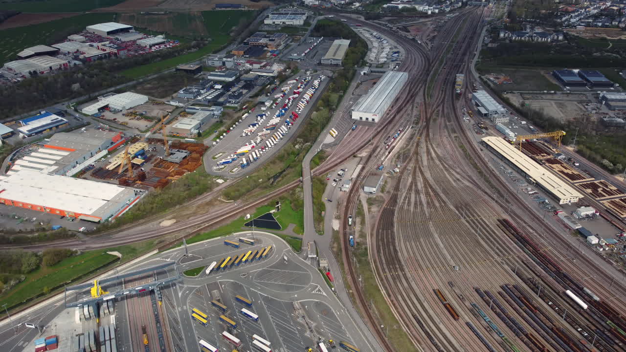 Aerial View of Industrial Transportation Hub with Train Station and Trucking