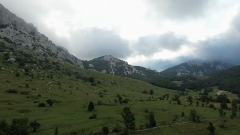 Aerial-view:-Field-of-mountains-on-a-cloudy-morning