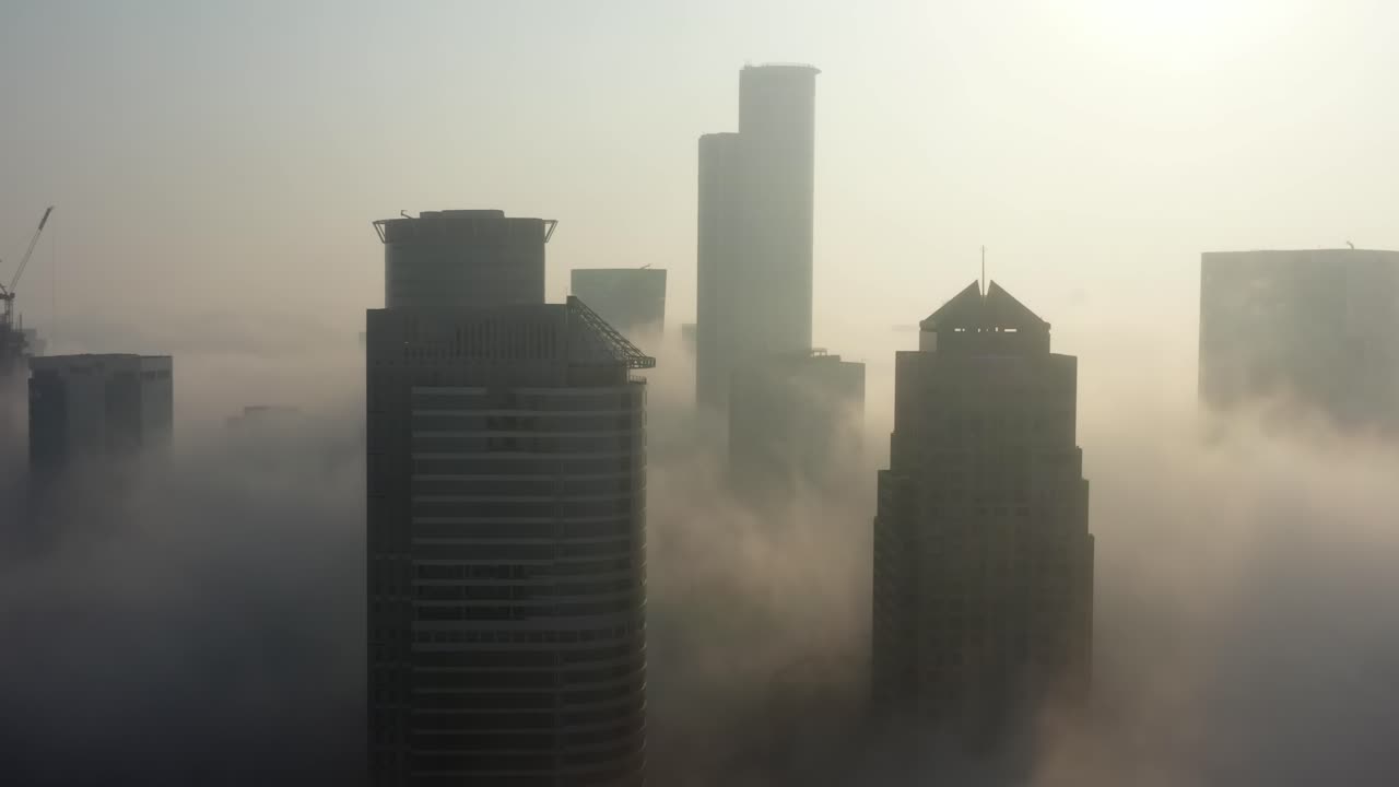 Foggy City Skyline at Sunrise