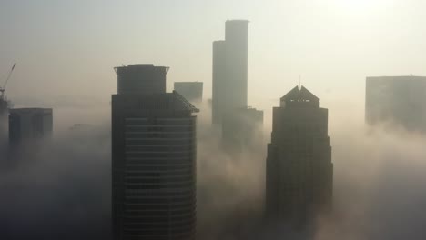foggy city skyline at sunrise