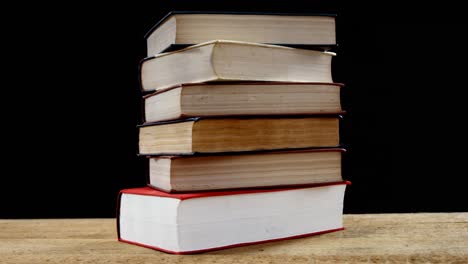 stack of various book on table