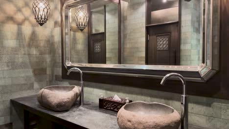 elegant stone sink and modern fixtures in a luxury resort bathroom, featuring ambient lighting and sophisticated design elements