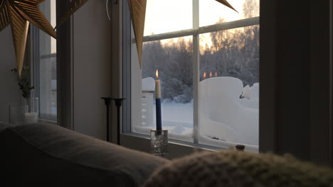 candle burning for memorial of finland independence day in cozy home