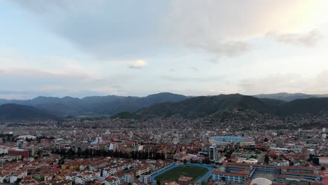 Panoramic-View-Over-Cusco-City-And-Stadiums-In-Peru---aerial-drone-shot