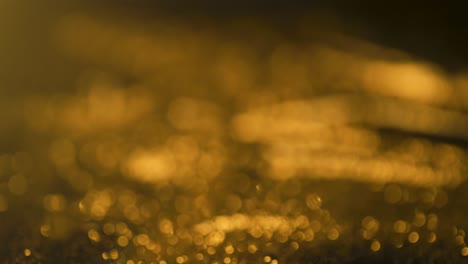 Abstract-golden-glitter,-out-of-focus-bokeh-light-painting