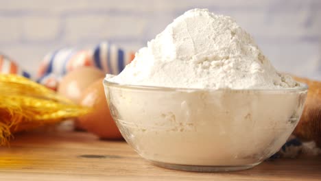 flour in a glass bowl with baking ingredients