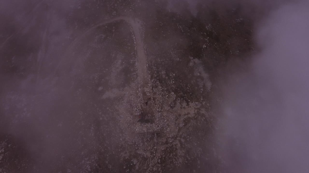 Drone shot over fog on mountain