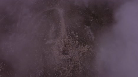 drone shot over fog on mountain