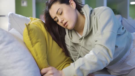 young woman sleeping on sofa.