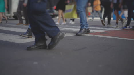 people crossing a busy street