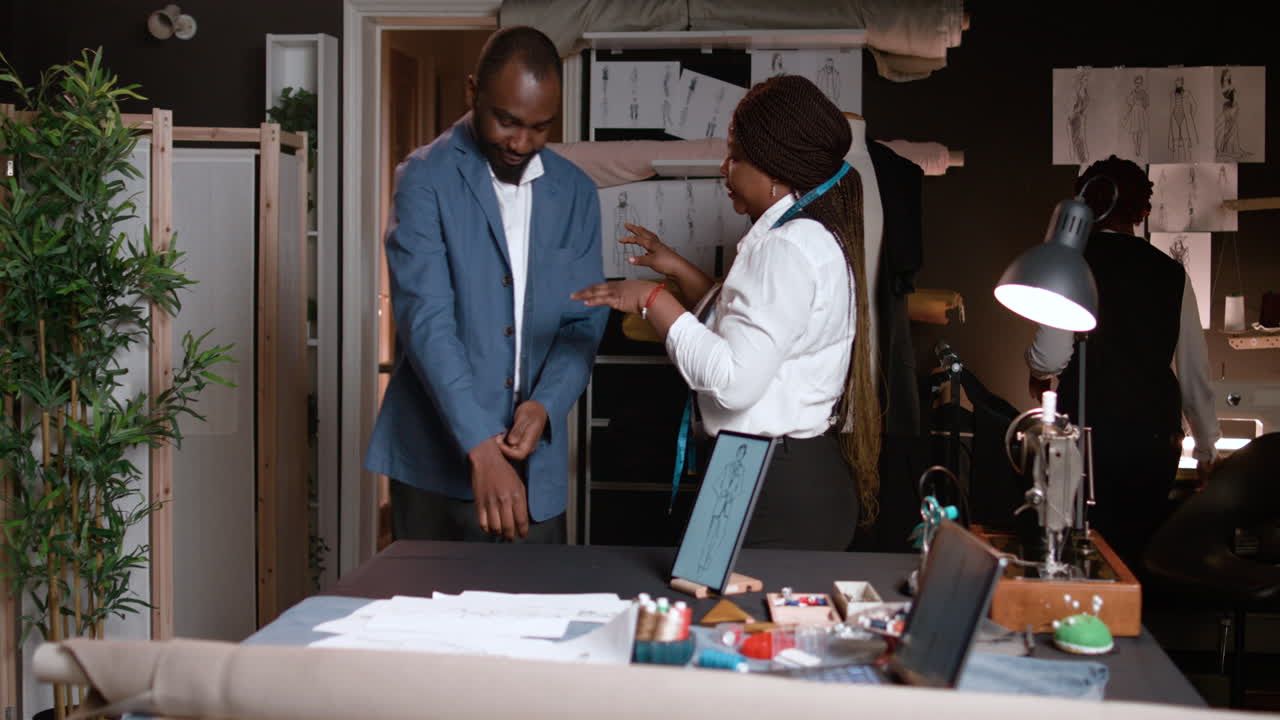 Tailors working with client