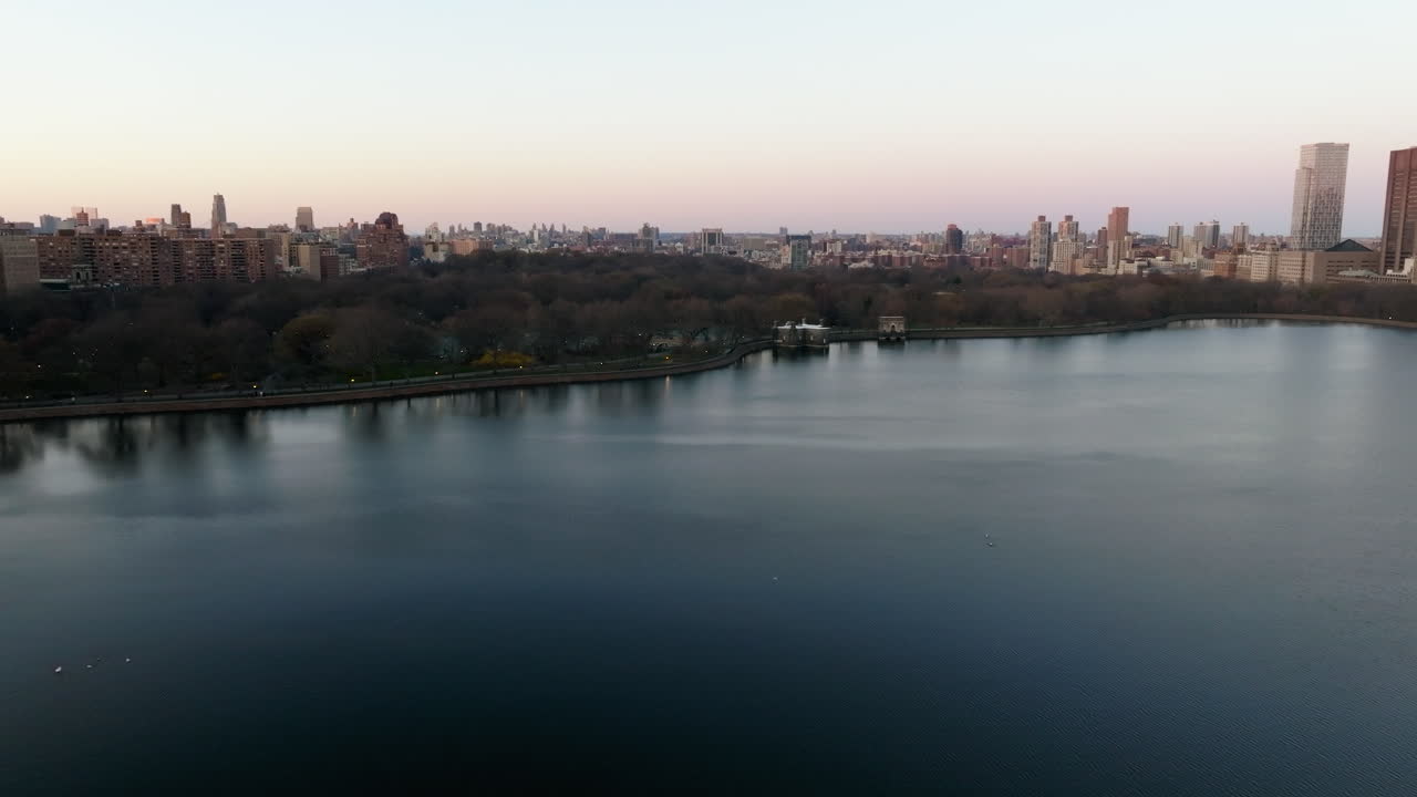 Aerial view over the reservoir, toward the north coast of Central park, sunset in New York, USA