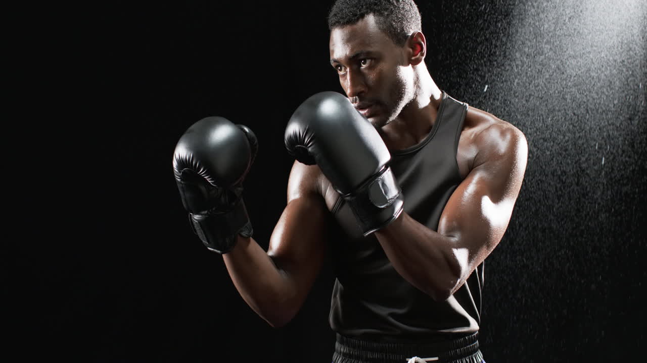 Montage video of african american male boxes in boxing gloves or black background