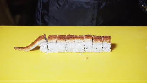 chef preparing eel sushi