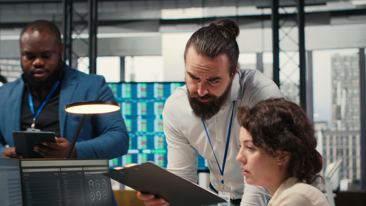 Vertical Video Professional colleagues team analyzing online graphs and resource allocation