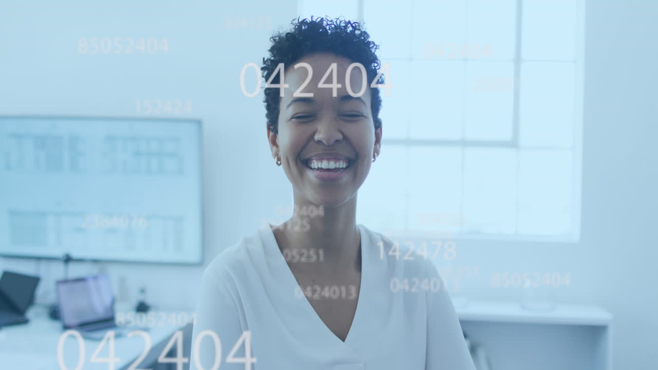 Animation of multiple changing numbers against portrait of african american woman smiling at office