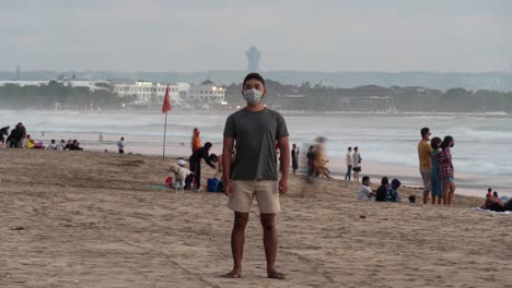 man wearing a mask on a bali beach