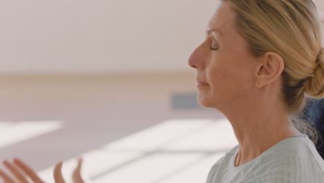 yoga-class-beautiful-old-woman-exercising-healthy-meditation-practice-head-to-knee-forward-bend-pose-enjoying-group-physical-fitness-workout-in-studio