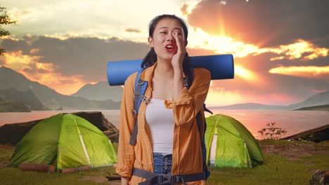 happy woman camping at sunset