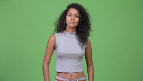 young happy beautiful hispanic woman with curly hair