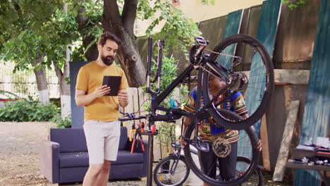 Couple-researching-for-bike-maintenance