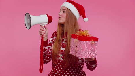 Woman-girl-in-Christmas-sweater-with-gift-box-scream-in-megaphone-announces-discounts-sale-shopping