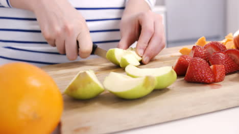 Close-up-on-a-woman-carving-some-fruits