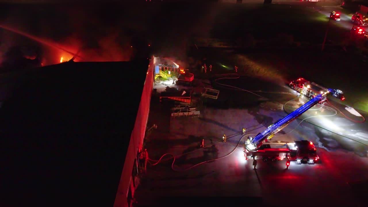 Side View of Polymer Plant Factory as Fire Fighters Respond to Inferno