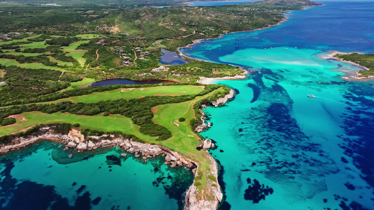 Aerial drone view of beautiful coastline of Corsica, France. High view of the colorful turquoise sea and the picturesque green landscape. Bird's eye view of the beaches. Summer holidays destination