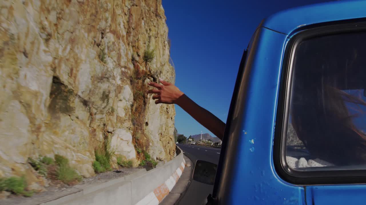 Young woman on a road trip in pick-up truck