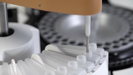 macro close up gimbal shot of mechanism of blood cbc machine working