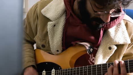 a man playing an electric guitar