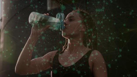 Animation-of-network-of-connections-with-icons-over-biracial-woman-working-out-drinking-water