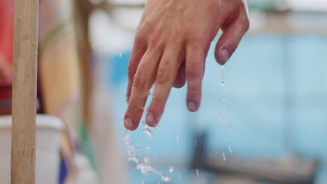 farmer washing hands with water in farm