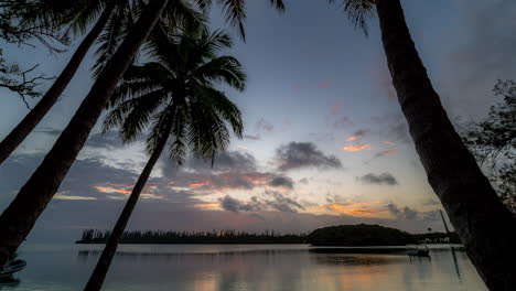 Tropical-sunset-time-lapse-with-clouds-at-Kanumera-Beach,-Isle-of-Pines,-New-Caledonia