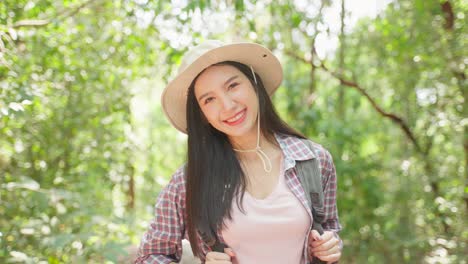 happy woman hiking in the forest