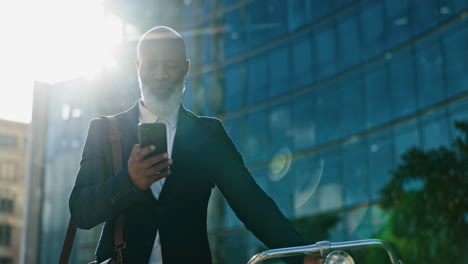 City,-bicycle-and-business-man-with-phone