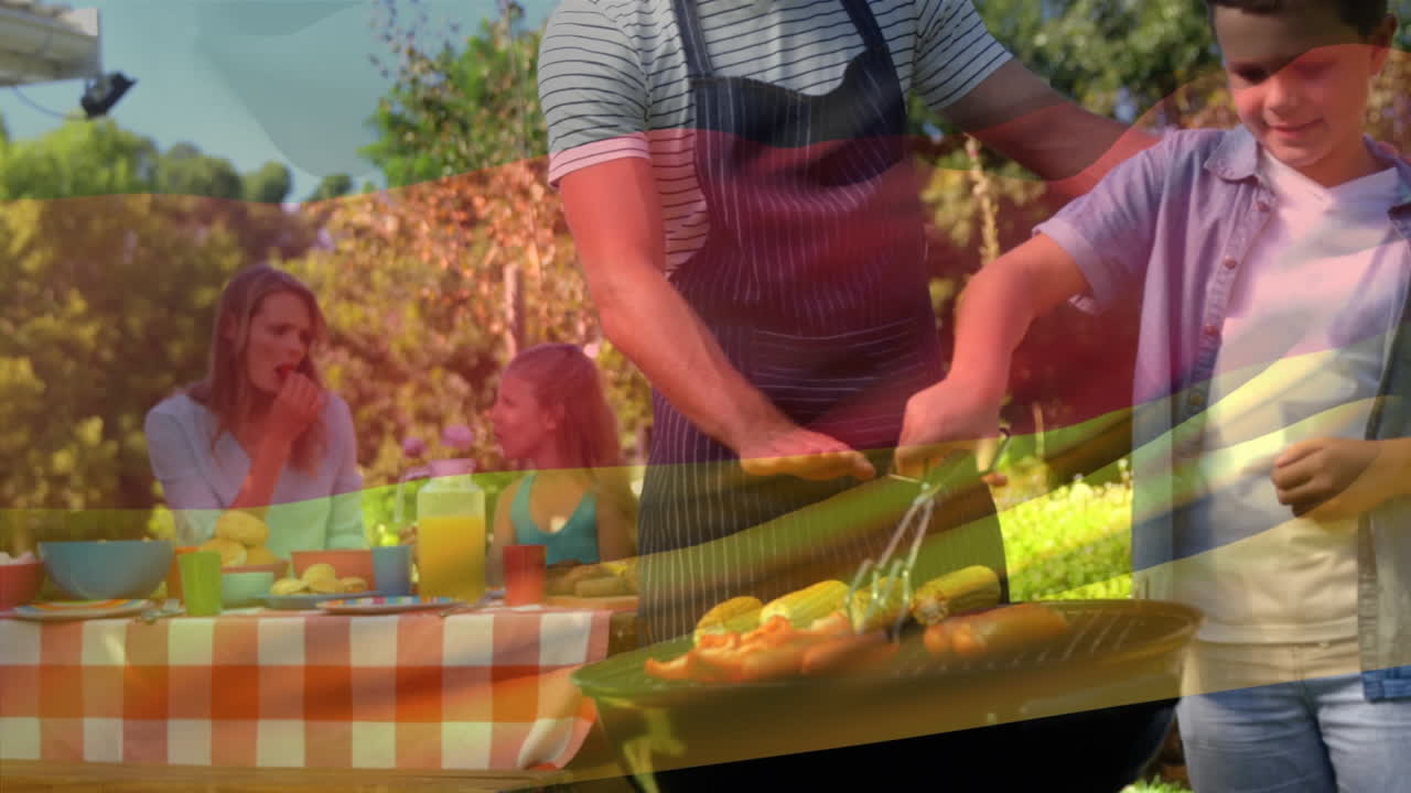 독일 국기 애니메이션을 통해 야외 파티를 하는 백인 가족