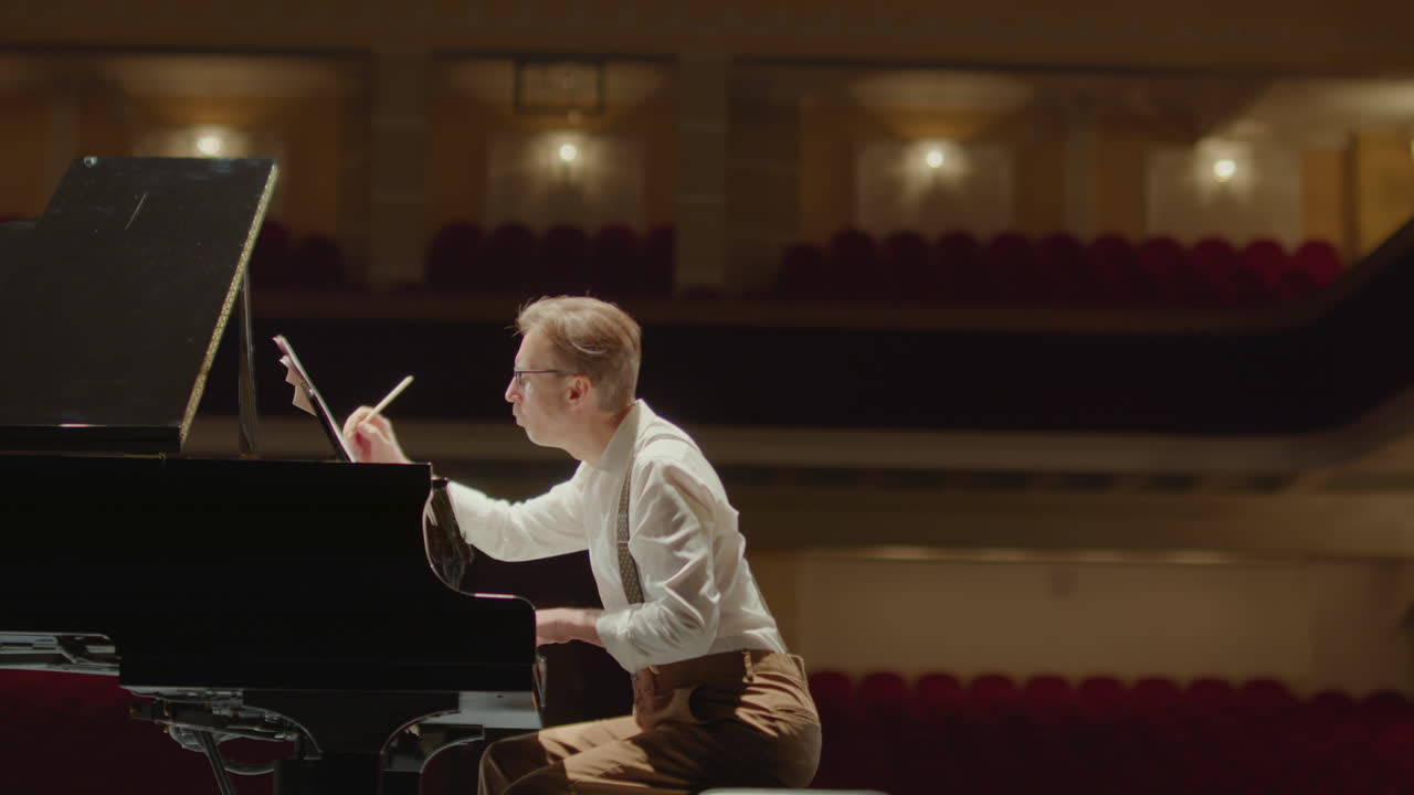 Composer Writing Piano Sheet Music and Throwing Paper Away