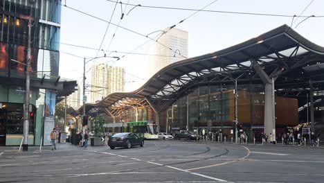 pedestrians and vehicles at melbourne's southern cross station